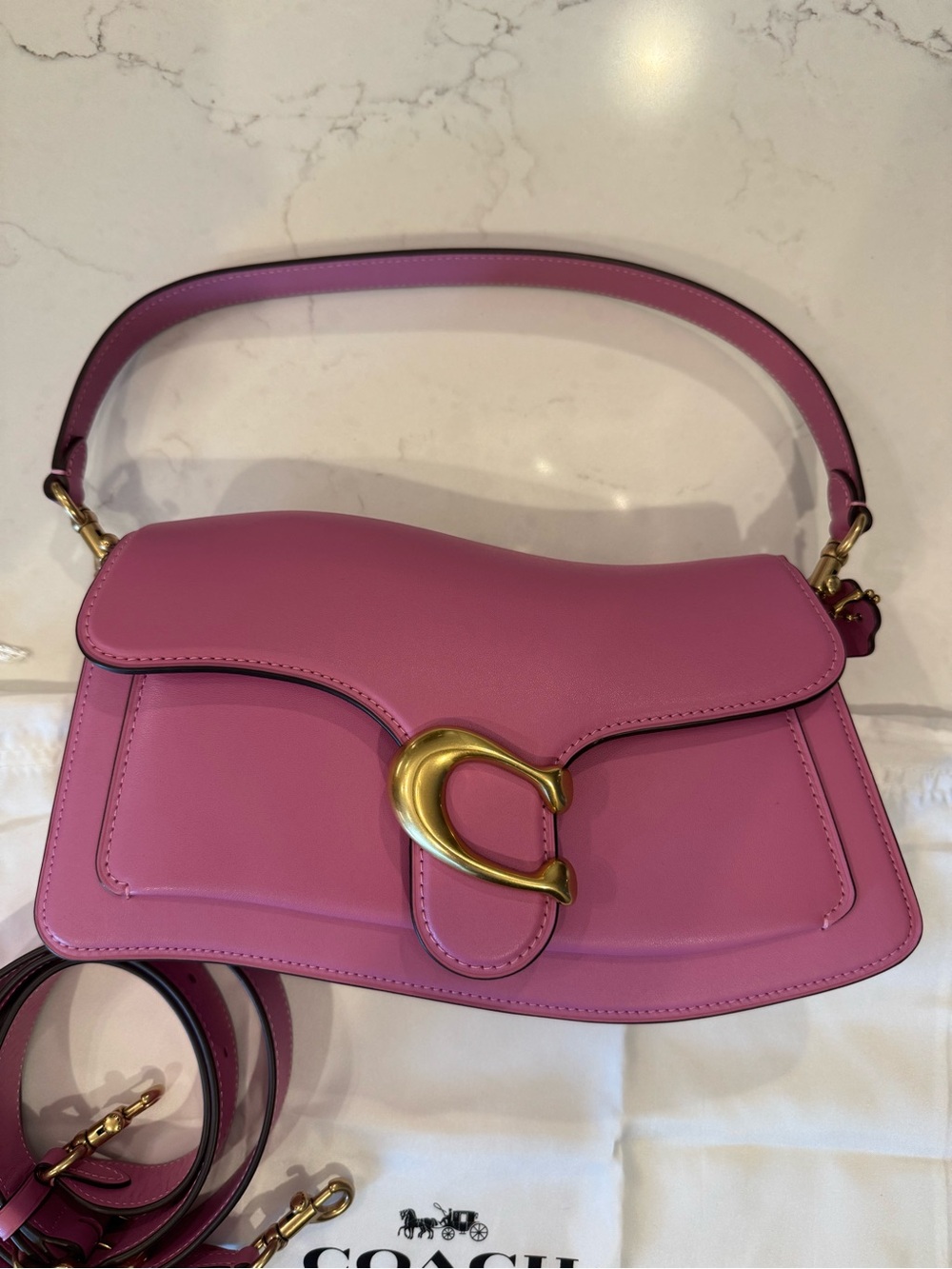 Coach Twisted Tabby Shoulder Bag in a fuchsia pink colorway with brass hardware
